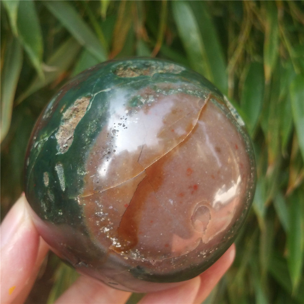 Crystal carved ball of Ocean Jasper
