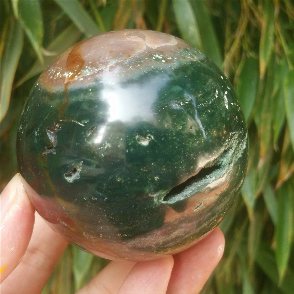 Crystal carved ball of Ocean Jasper