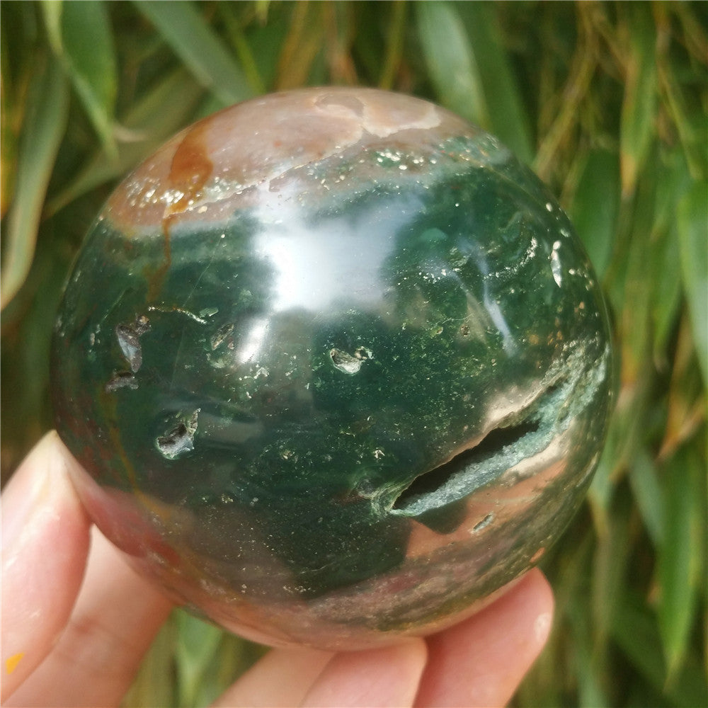 Crystal carved ball of Ocean Jasper