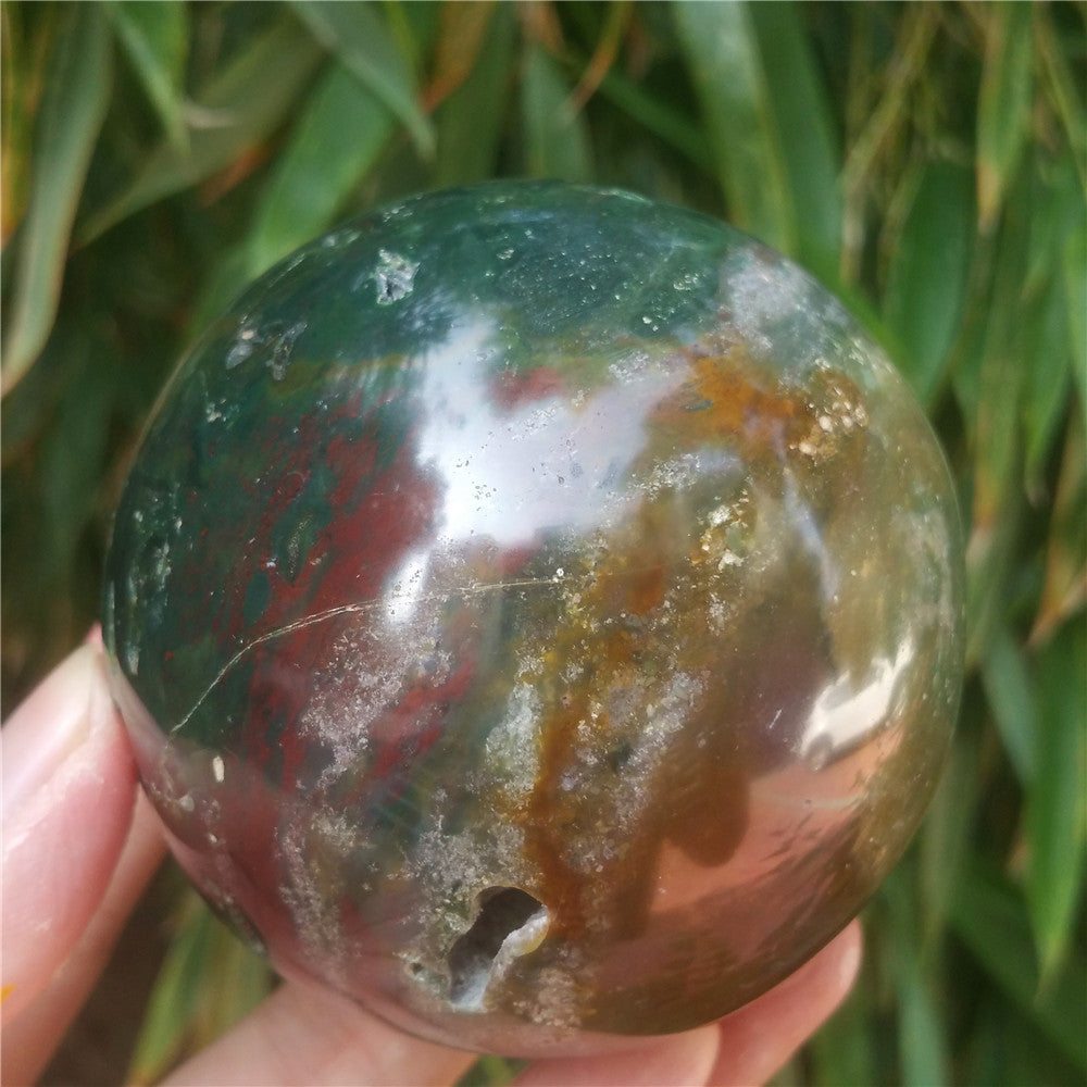 Crystal carved ball of Ocean Jasper