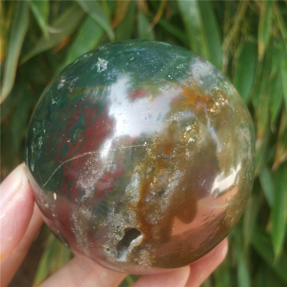 Crystal carved ball of Ocean Jasper