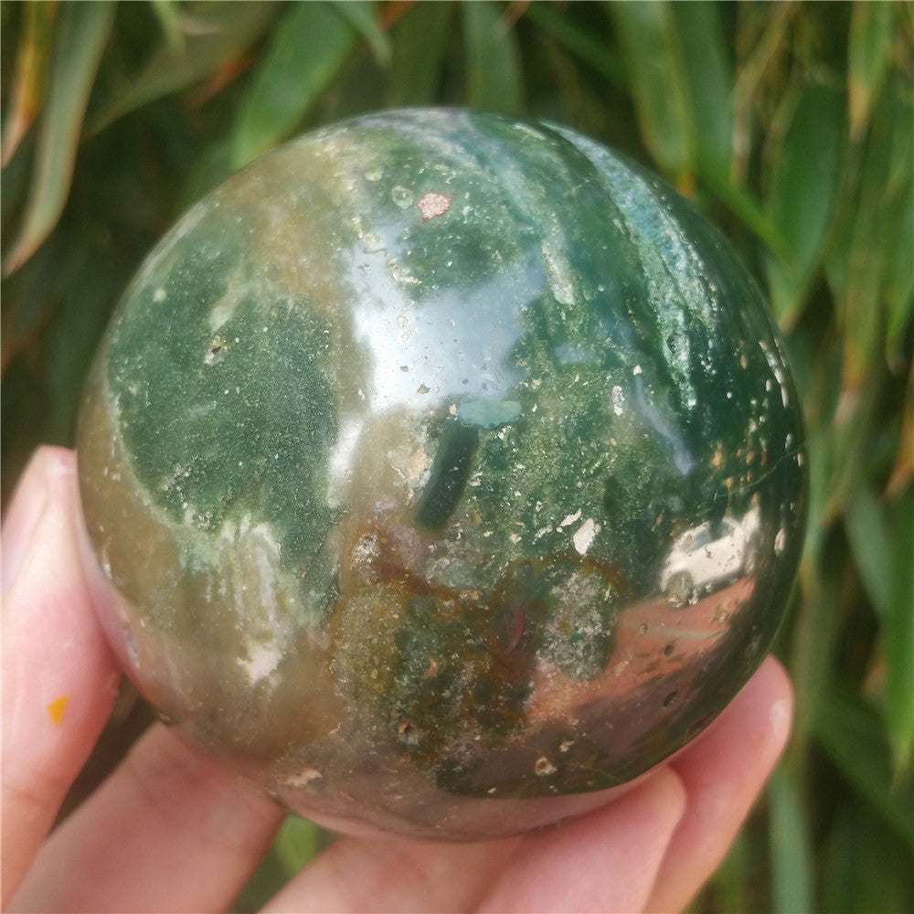 Crystal carved ball of Ocean Jasper