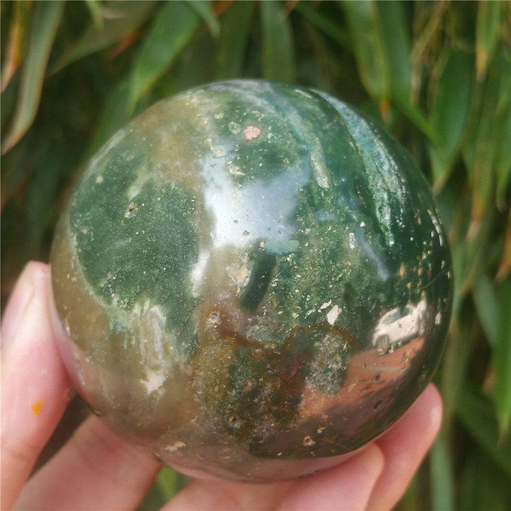 Crystal carved ball of Ocean Jasper