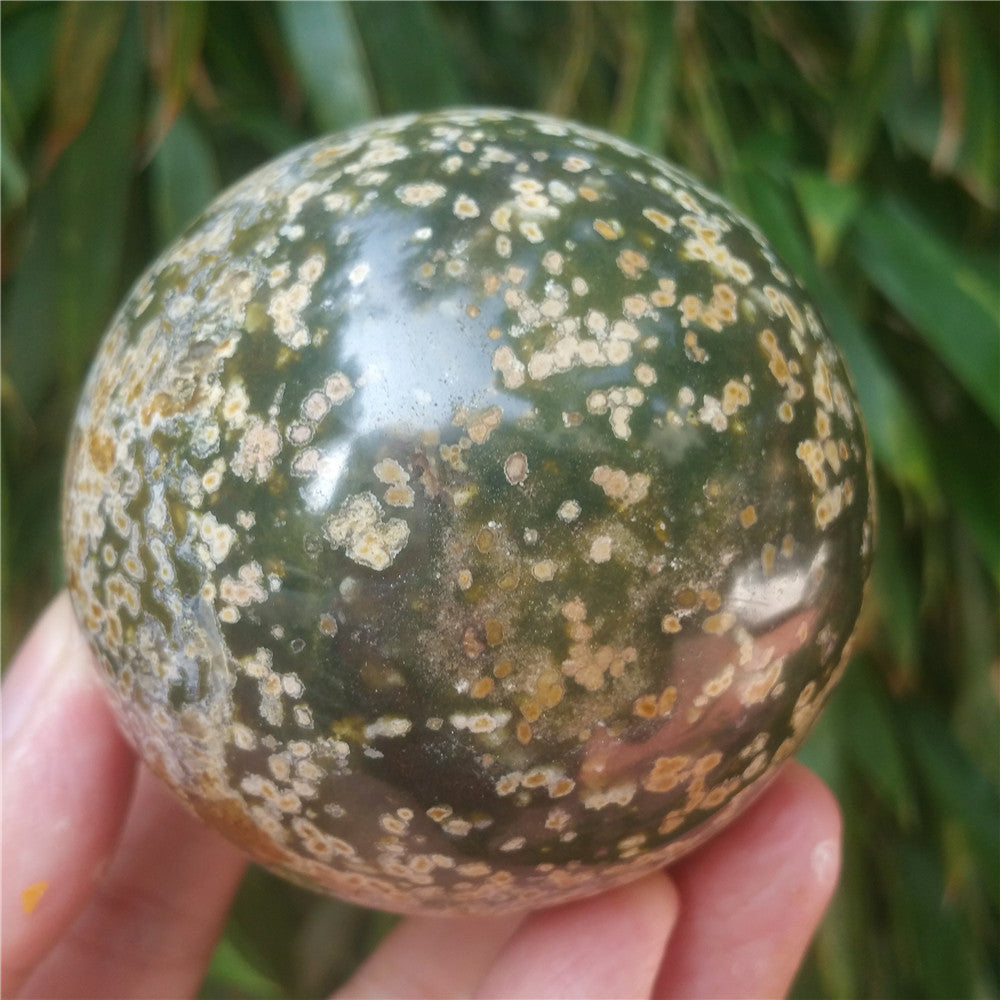 Crystal carved ball of Ocean Jasper