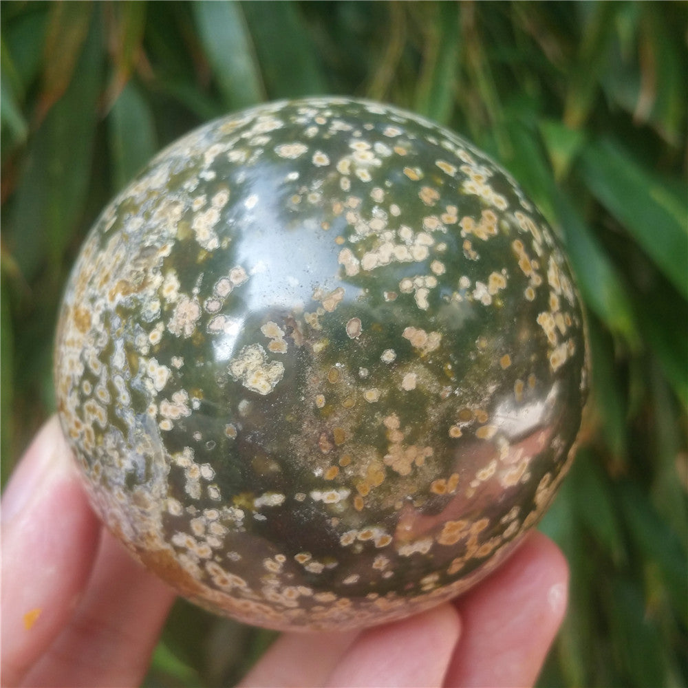 Crystal carved ball of Ocean Jasper