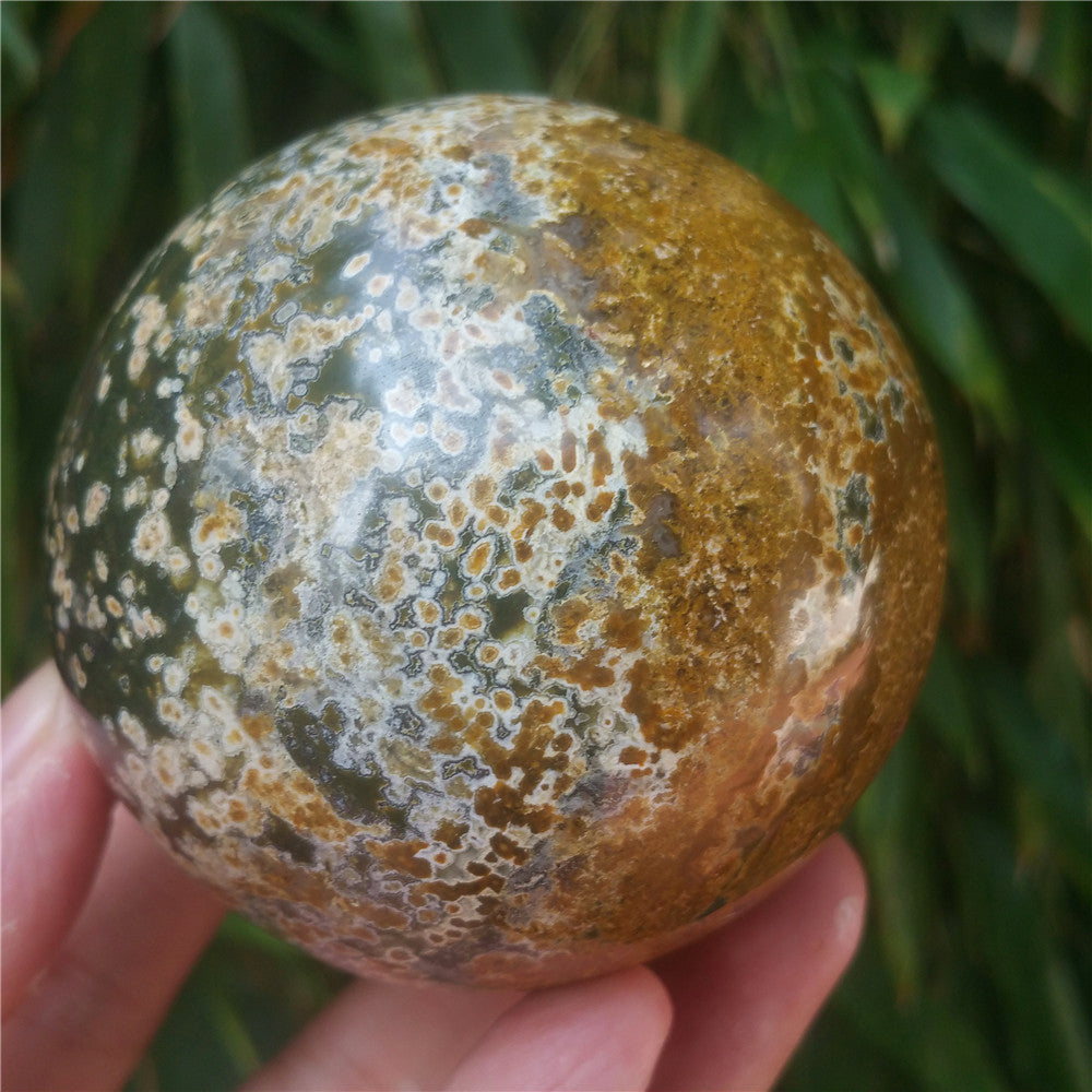 Crystal carved ball of Ocean Jasper