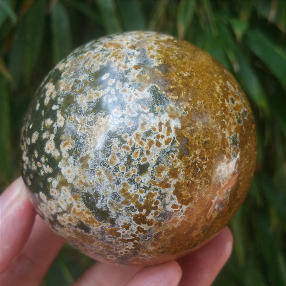 Crystal carved ball of Ocean Jasper