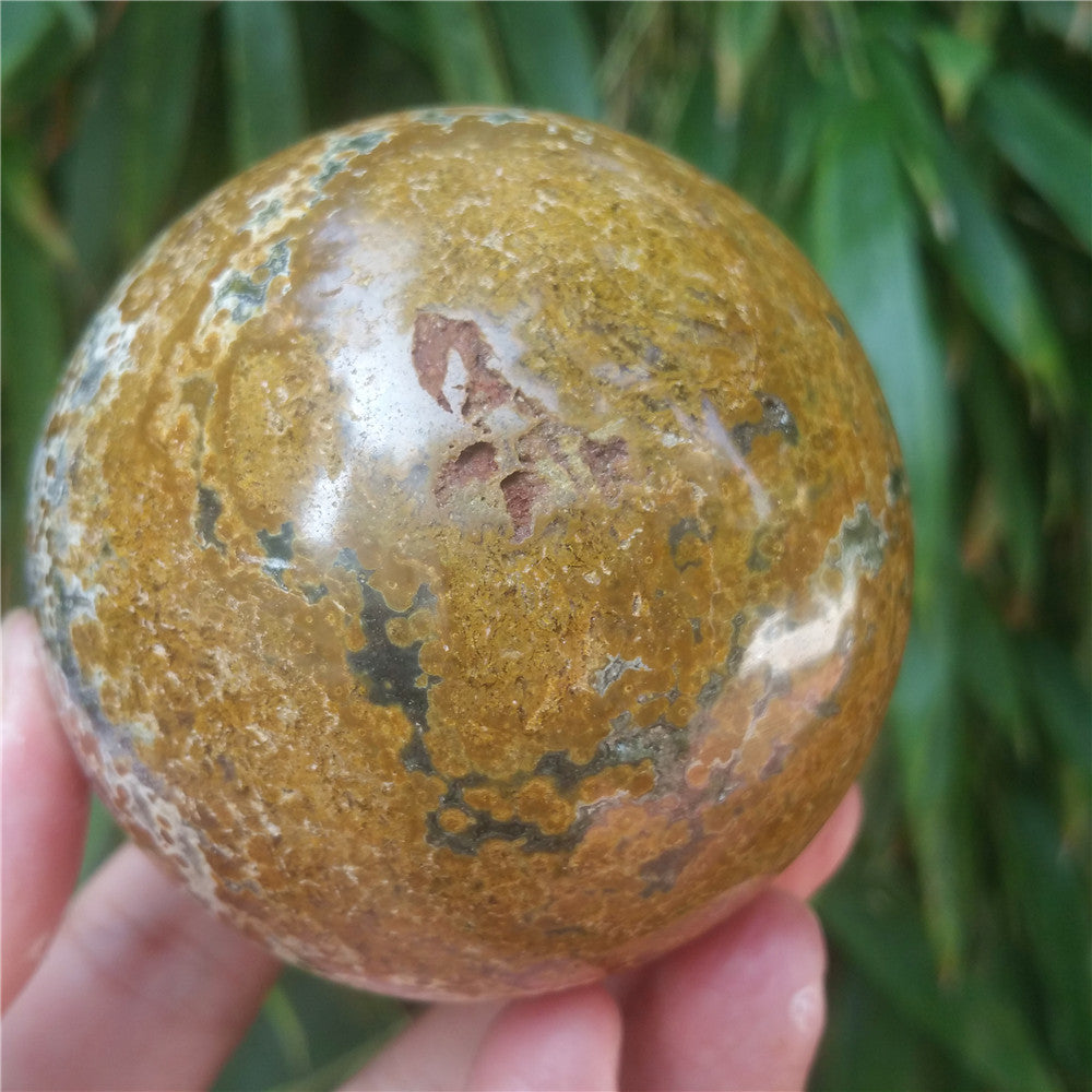 Crystal carved ball of Ocean Jasper