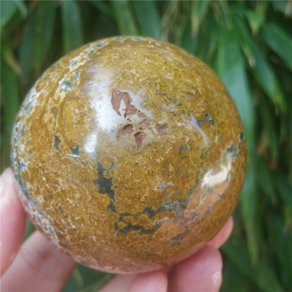 Crystal carved ball of Ocean Jasper