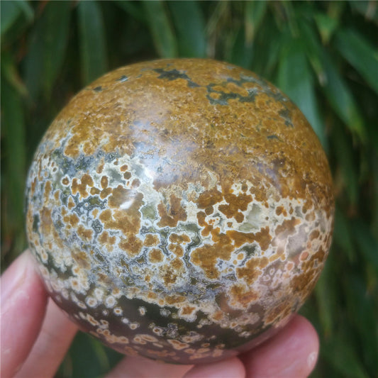 Crystal carved ball of Ocean Jasper
