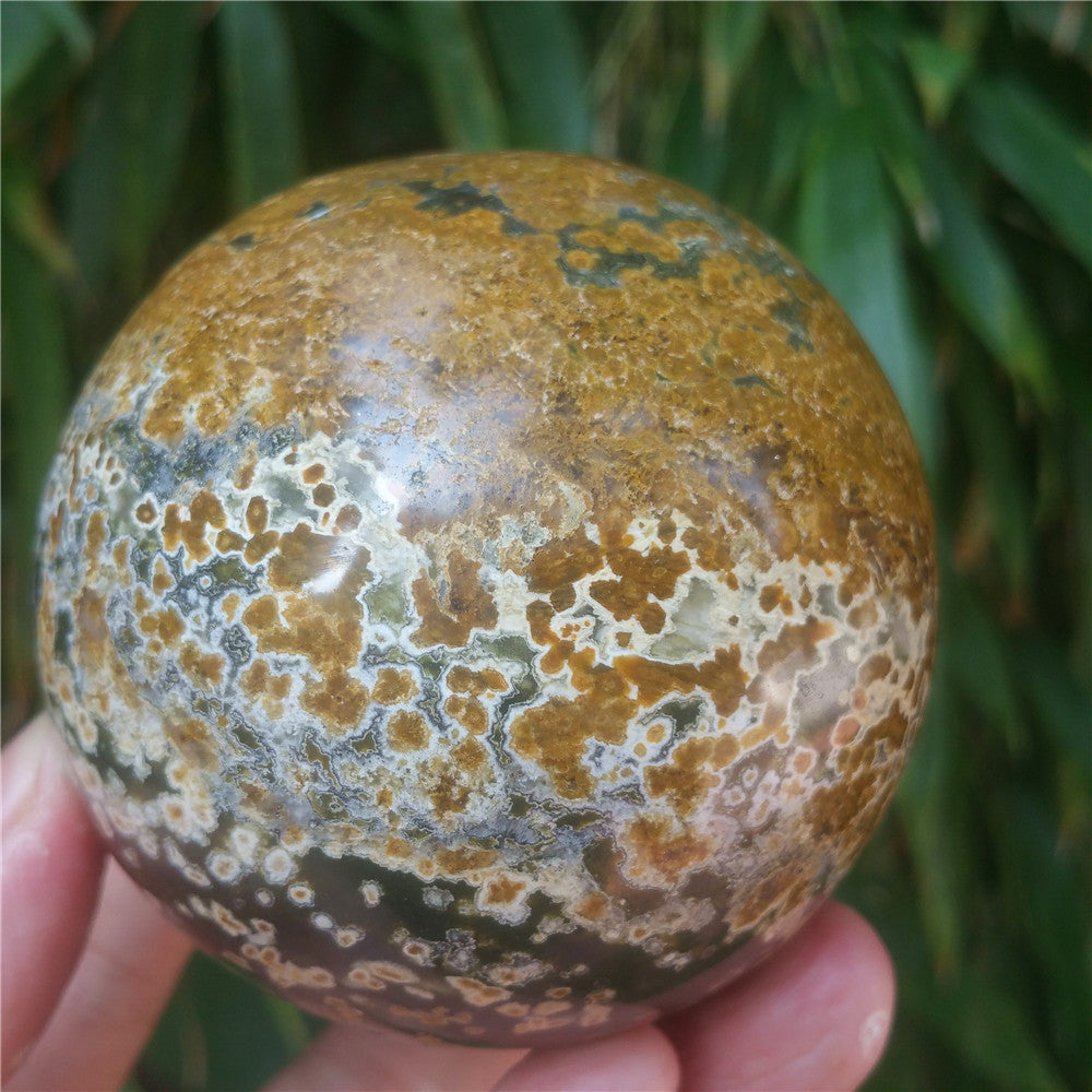 Crystal carved ball of Ocean Jasper