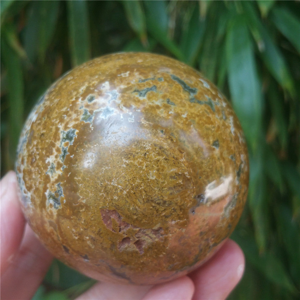 Crystal carved ball of Ocean Jasper