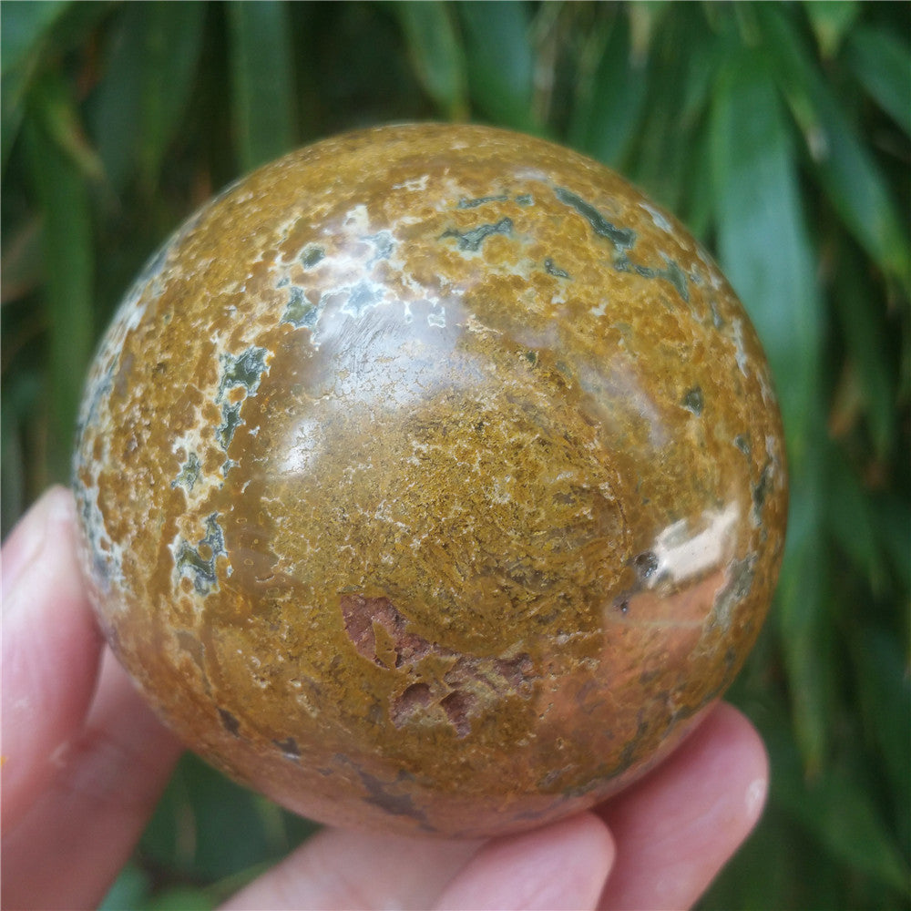 Crystal carved ball of Ocean Jasper