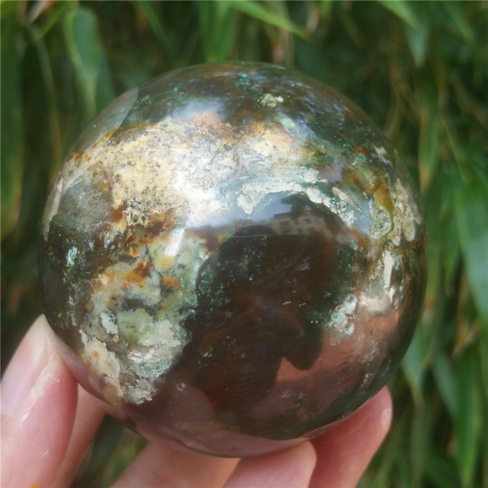 Crystal carved ball of Ocean Jasper