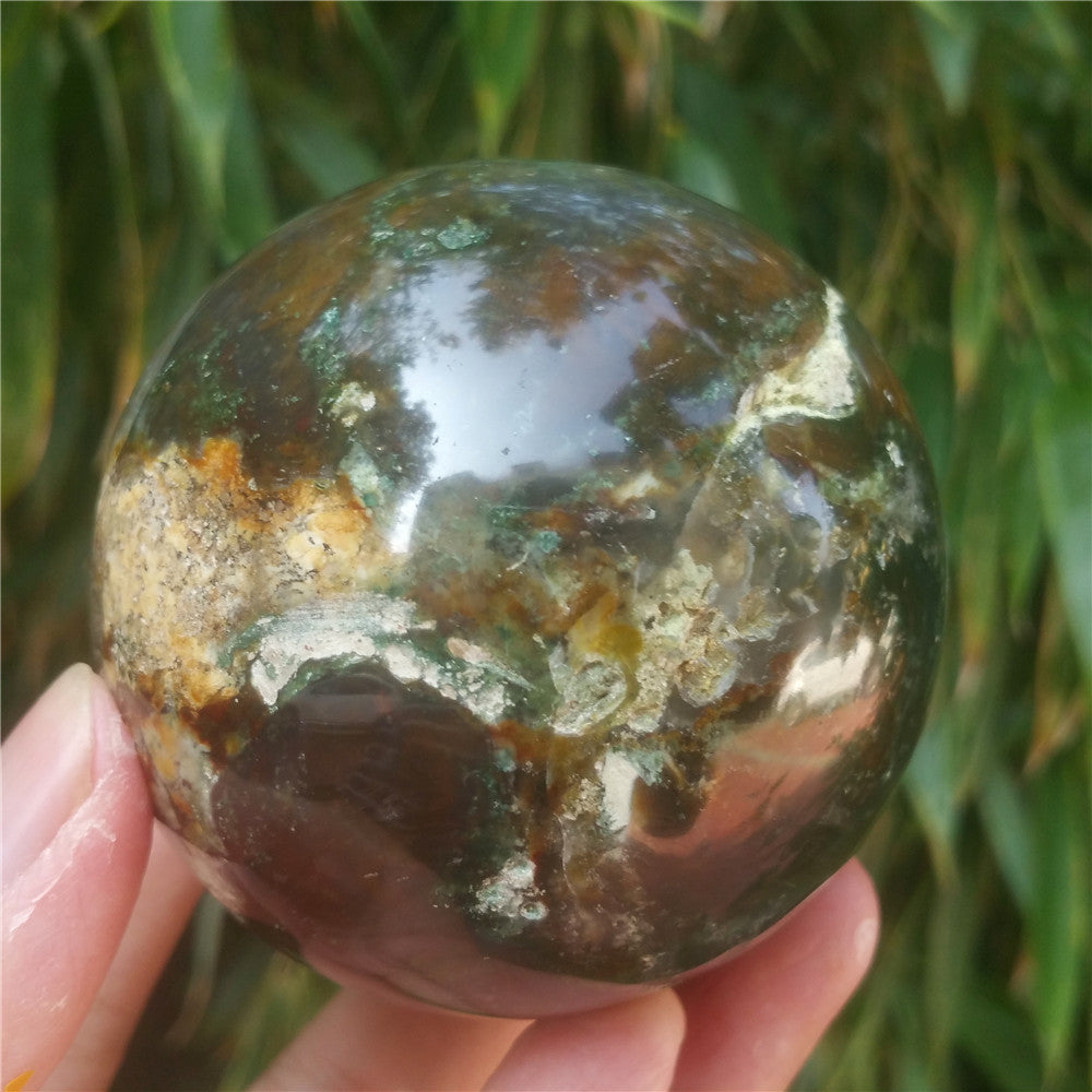 Crystal carved ball of Ocean Jasper