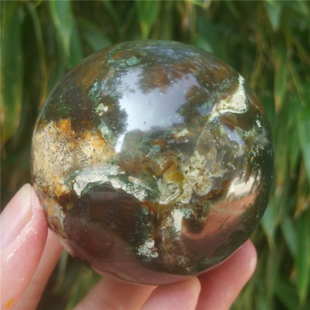 Crystal carved ball of Ocean Jasper