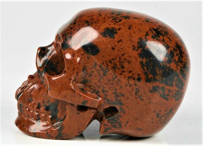 Beautiful rosewood Obsidian carved Skull