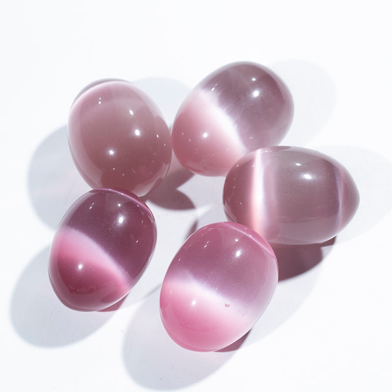 Venta al por mayor huevos cristalinos del yoni del huevo del ojo de gato rosado huevos del cristal de cuarzo