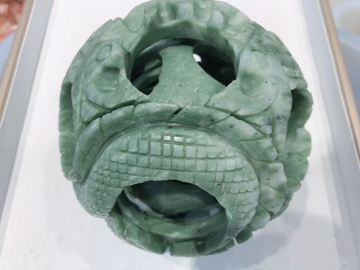 The exquisite Xiuyu jade carving feng shui ball in the east