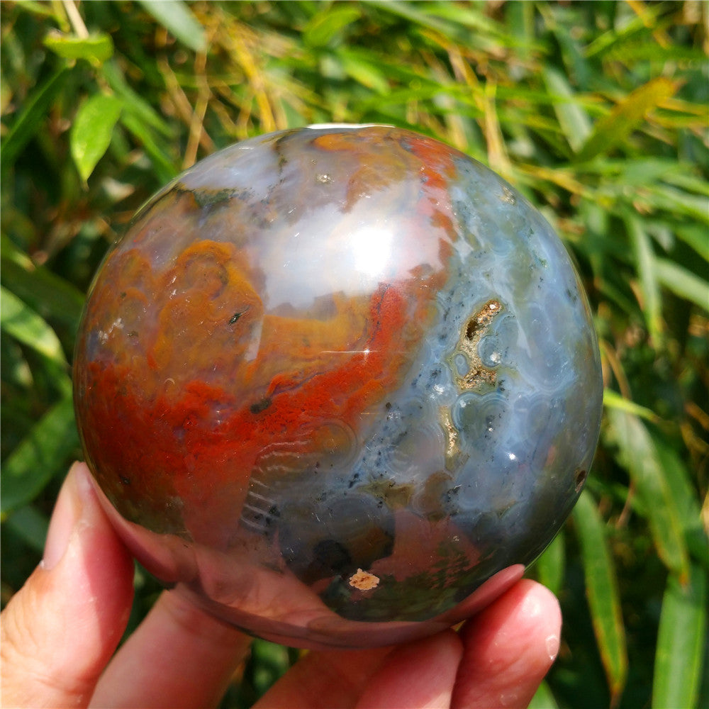 Crystal carved ball of Ocean Jasper