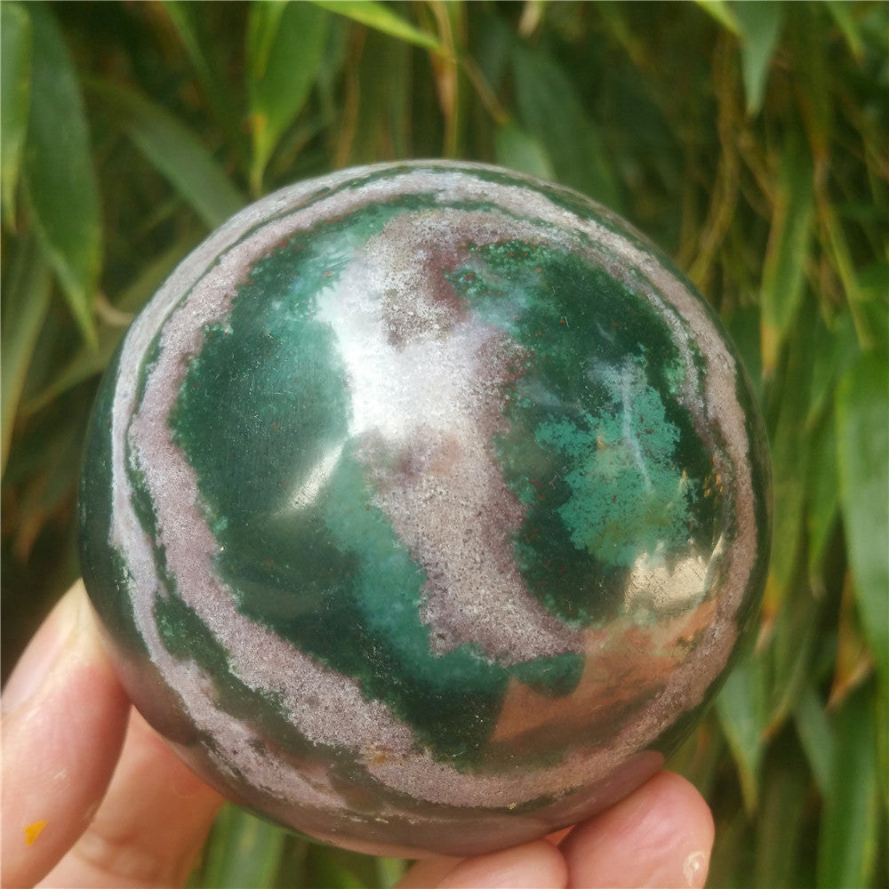 Crystal carved ball of Ocean Jasper