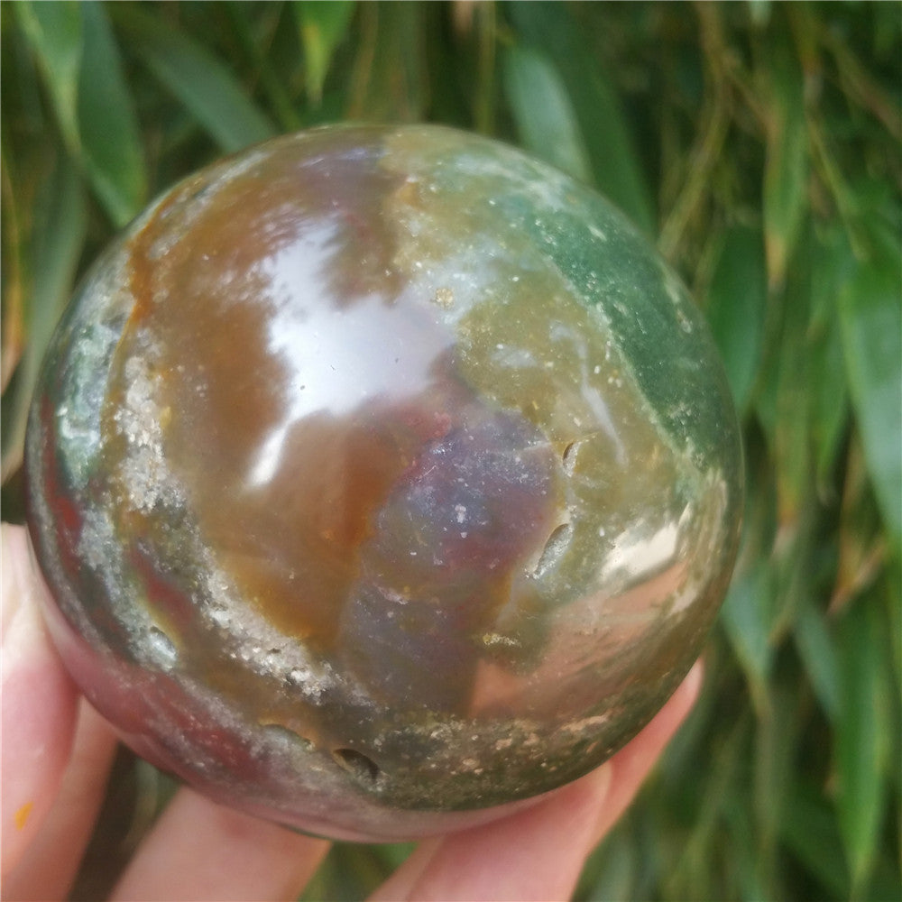 Crystal carved ball of Ocean Jasper